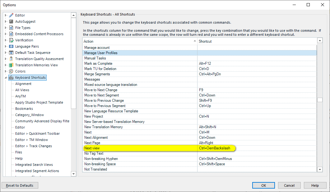 Trados Studio options window showing Keyboard Shortcuts with 'Next view' highlighted and assigned to Ctrl+OemBackslash.