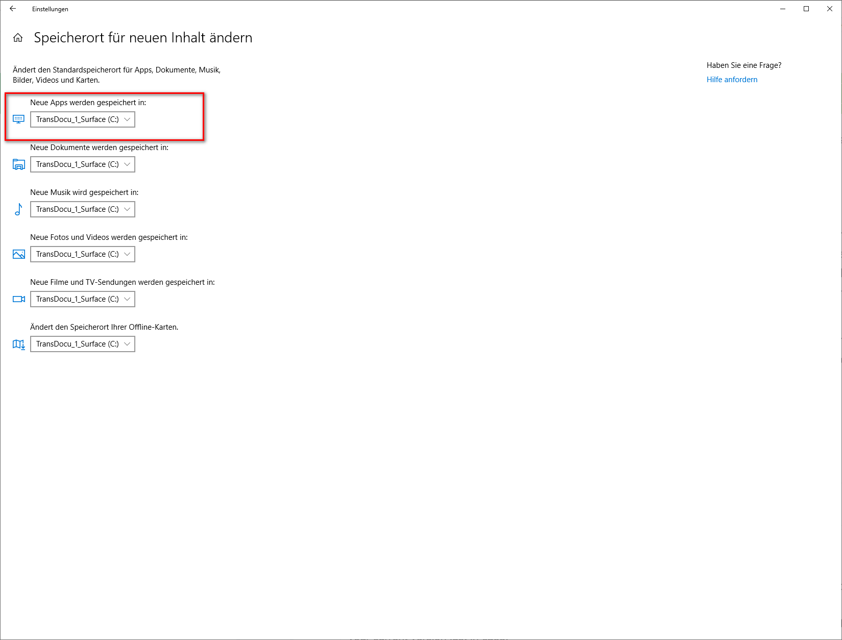 Windows settings screenshot showing options for changing the default save location for new apps, documents, music, pictures, videos, and offline maps to drive C:.