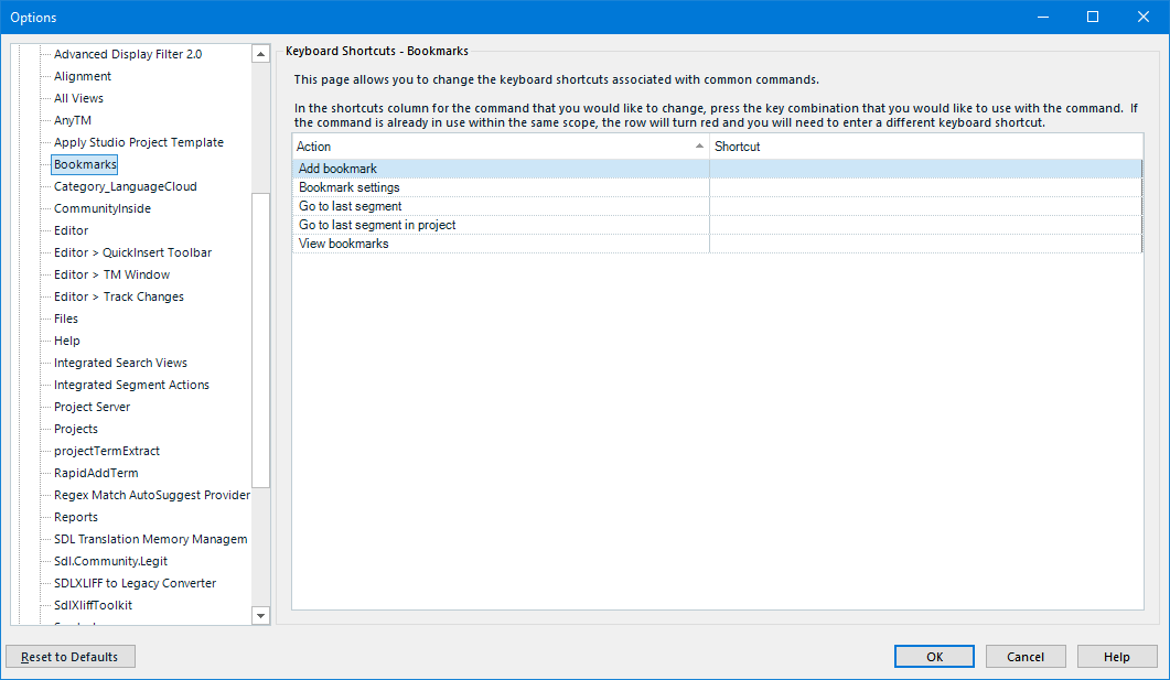 Trados Studio options window showing Keyboard Shortcuts for Bookmarks with a list of actions such as Add bookmark, Bookmark settings, Go to last segment, Go to last segment in project, and View bookmarks. The Shortcut column is empty, indicating no shortcuts are currently assigned.