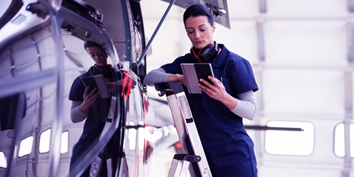 Maintenance repair being performed on aircraft.