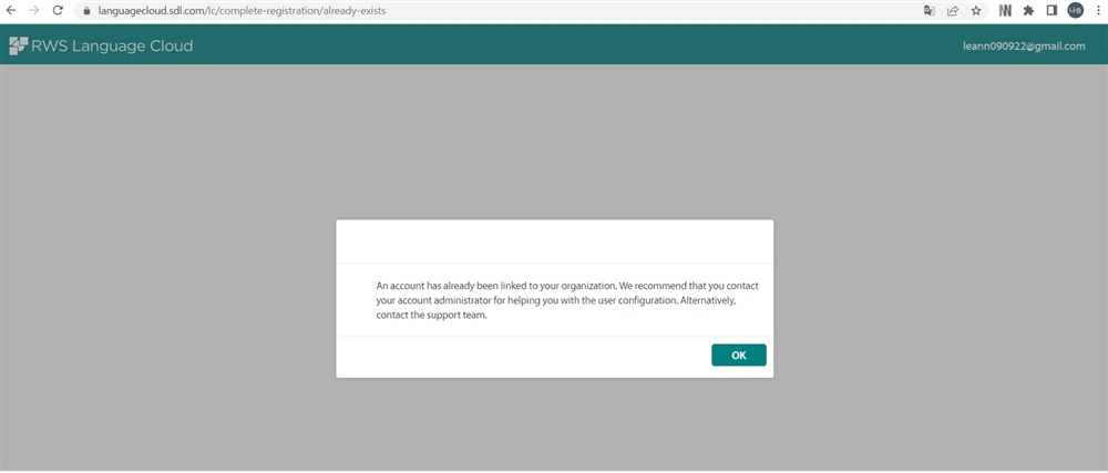 Error message on RWS Language Cloud login page stating 'An account has already been linked to your organization. We recommend that you contact your account administrator for helping you with the user configuration. Alternatively, contact the support team.' with an OK button.