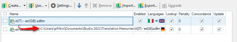 Trados Studio project settings showing two translation memories, one with a red exclamation mark indicating an issue.