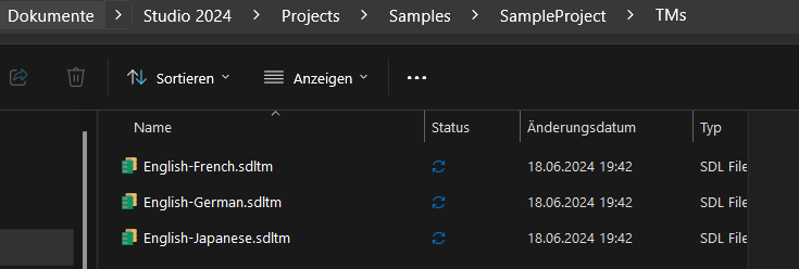 File explorer window showing Trados Studio 2024 Sample Project folder with a subfolder named TMs containing three SDL Trados translation memory files: English-French, English-German, and English-Japanese, all modified on 18.06.2024 at 19:42.