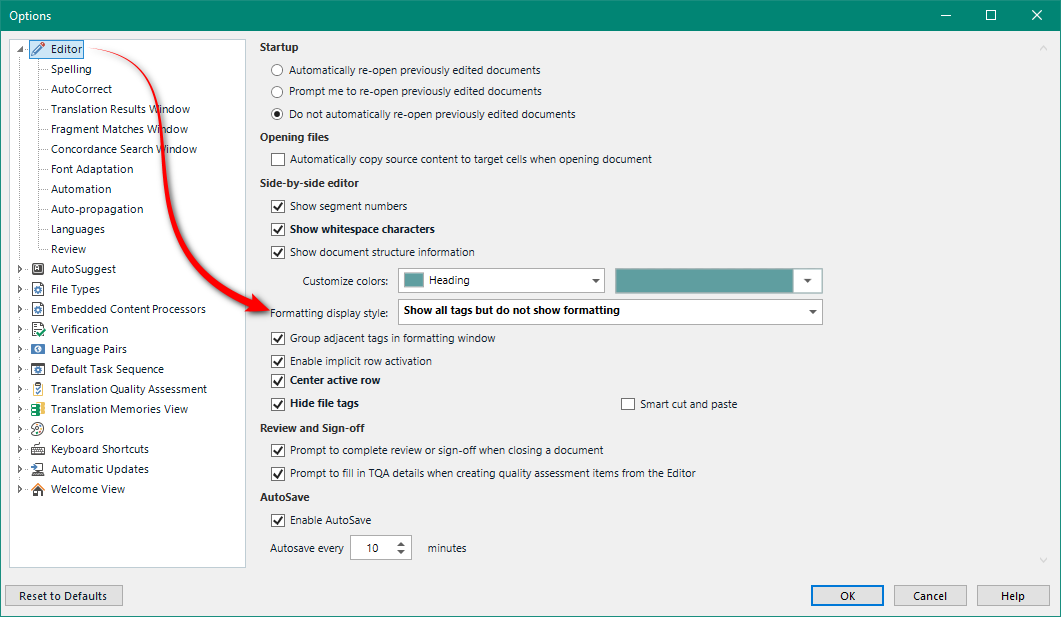 Trados Studio options menu with Editor settings open, showing various preferences such as 'Show segment numbers' and 'Show whitespace characters' with 'Show all tags but do not show formatting' selected in the Formatting display style dropdown.