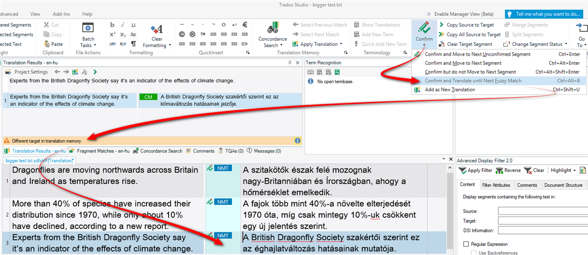 Trados Studio interface showing a translation project with a warning about a different target in translation memory.