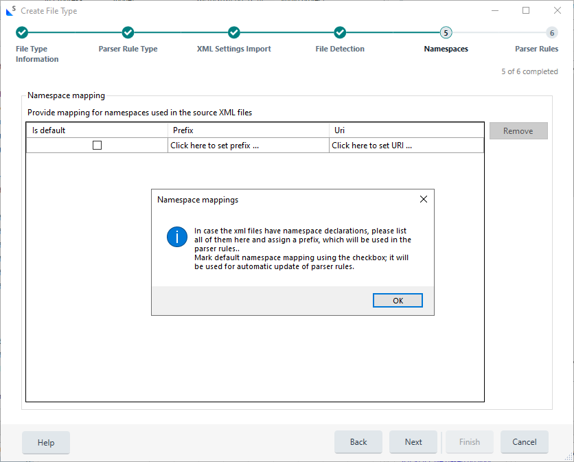 Trados Studio 'Create File Type' wizard displaying the 'Namespace mapping' section with an information dialog box advising to list all namespaces and assign a prefix.