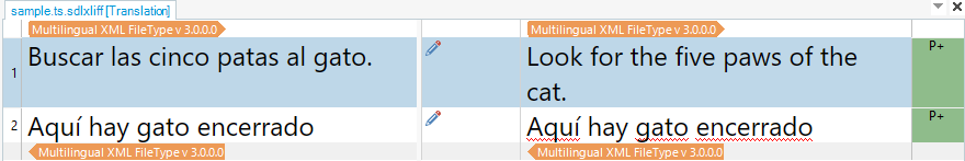 Trados Studio translation segment window with Spanish text 'Buscar las cinco patas al gato.' and its English translation 'Look for the five paws of the cat.'