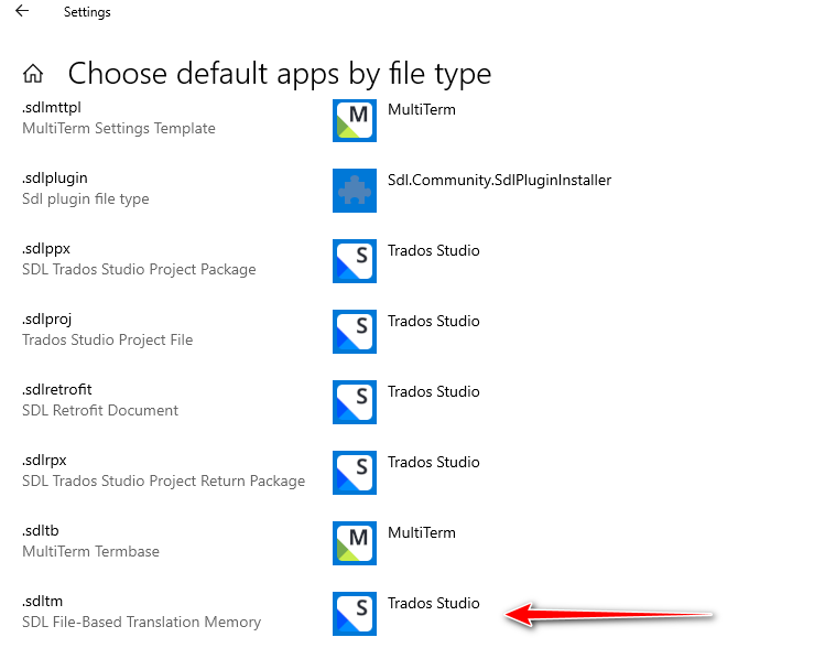 Windows Settings screen showing 'Choose default apps by file type' with a list of file extensions and associated applications. The '.sdltm' file extension is highlighted with Trados Studio selected as the default app.