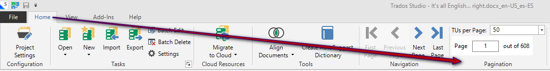 Trados Studio interface showing the Home tab with options like Open, New, Import, Export, and a highlighted arrow pointing to the Pagination section with TUs per Page set to 50.