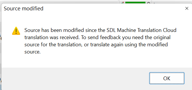 Warning message in Trados Studio stating 'Source modified. Source has been modified since the SDL Machine Translation Cloud translation was received. To send feedback you need the original source for the translation, or translate again using the modified source.' with an OK button.