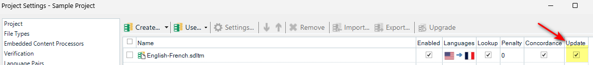 Close-up of Trados Studio Project Settings with 'English-French.sdltm' selected and a red arrow pointing to the 'Update' checkbox.