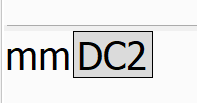 Screenshot showing 'mm' followed by a character resembling 'DC2' in a text properties editor.