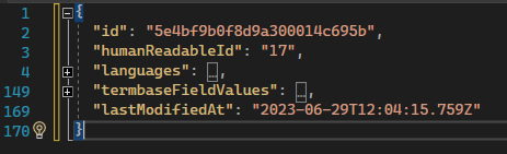 Screenshot of a JSON response in a code editor, showing an entry with fields 'id', 'humanReadableId', 'languages', 'termbaseFieldValues', and 'lastModifiedAt' with a timestamp.