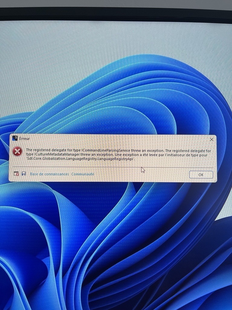 Error message on Windows screen: 'The registered delegate for type ICommandLineParsingService threw an exception. The registered delegate for ICultureMetadataManager threw an exception. Une exception a ete levee par l'initialiseur de type pour Sdl.Core.Globalization.LanguageRegistry.LanguageRegistryApi.' Options at the bottom: 'Base de connaissances' and 'Communaute' with an 'OK' button.