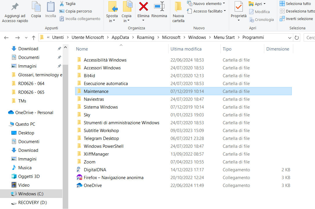 Screenshot of a Windows file explorer window showing the contents of the Start Menu Programs folder with various folders and shortcuts listed, such as Accessibility Windows, Windows Accessories, and OneDrive.