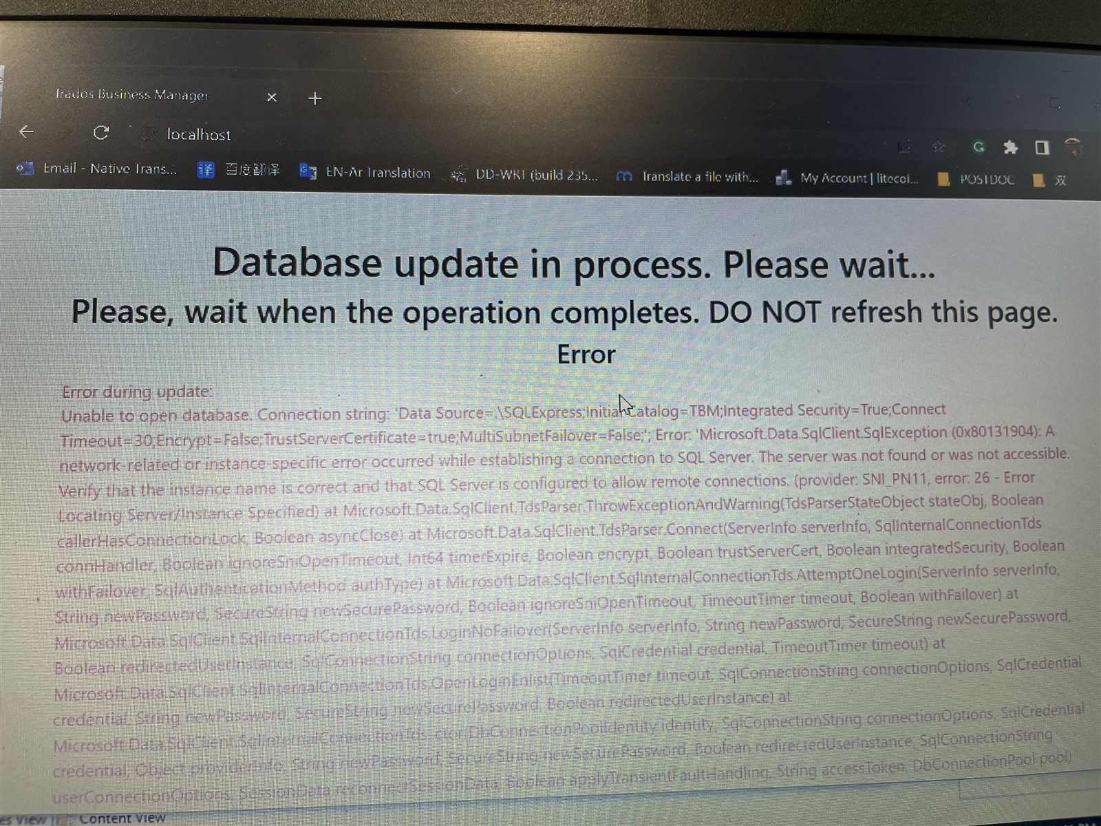 Error message on Trados Business Manager stating 'Database update in process. Please wait... Error during update: Unable to open database. Connection string: Data Source=...'