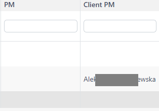 Trados Studio table with 'PM' column header and empty cell, adjacent to 'Client PM' column with a filled cell.