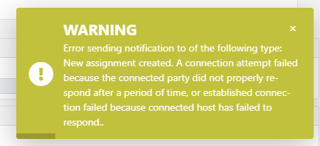 Warning message in Trados Studio showing an error in sending notification for a new assignment creation due to a connection attempt failure.