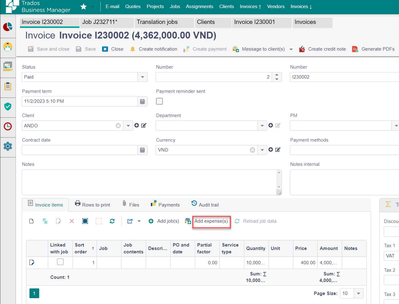 Trados Studio invoice creation screen showing an invoice for client ANDO with a status of 'Paid'. The 'Add expense(s)' button is visible but not functioning.