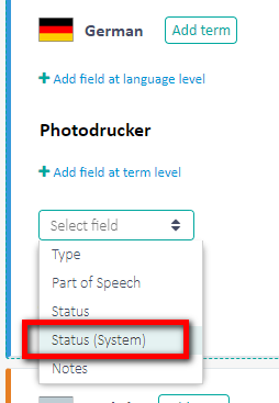 Trados Studio screenshot showing the dropdown menu for adding a field at term level with 'Status (System)' highlighted.