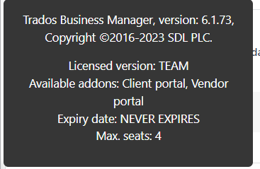 Trados Business Manager license information showing version 6.1.73, licensed version TEAM, with addons for Client portal and Vendor portal. Expiry date is listed as NEVER EXPIRES and maximum seats are 4.