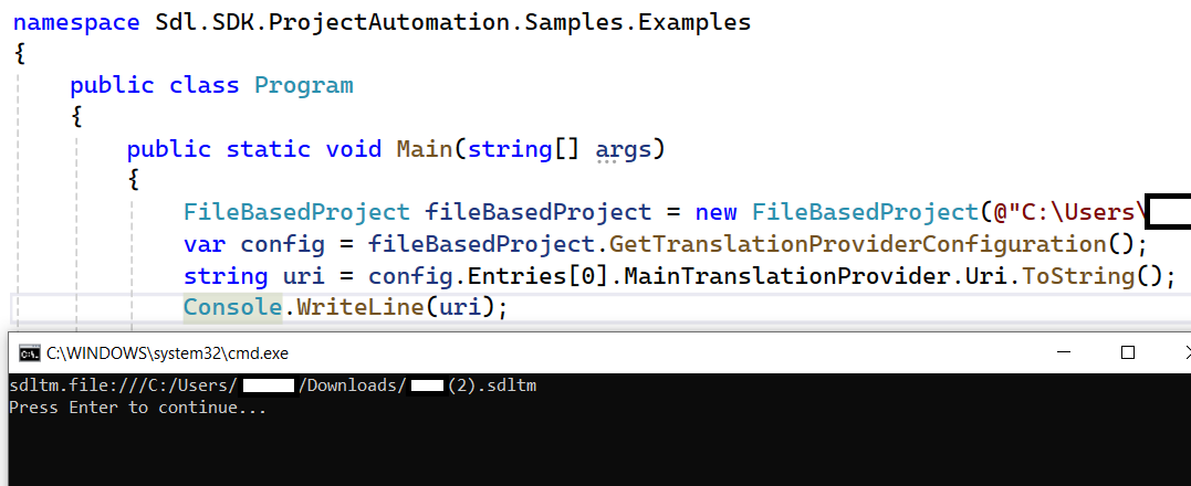 Screenshot of a code editor with C# code for the SDL SDK ProjectAutomation. The code initializes a FileBasedProject and prints a URI. A command prompt window is shown at the bottom displaying a file path and 'Press Enter to continue...'.