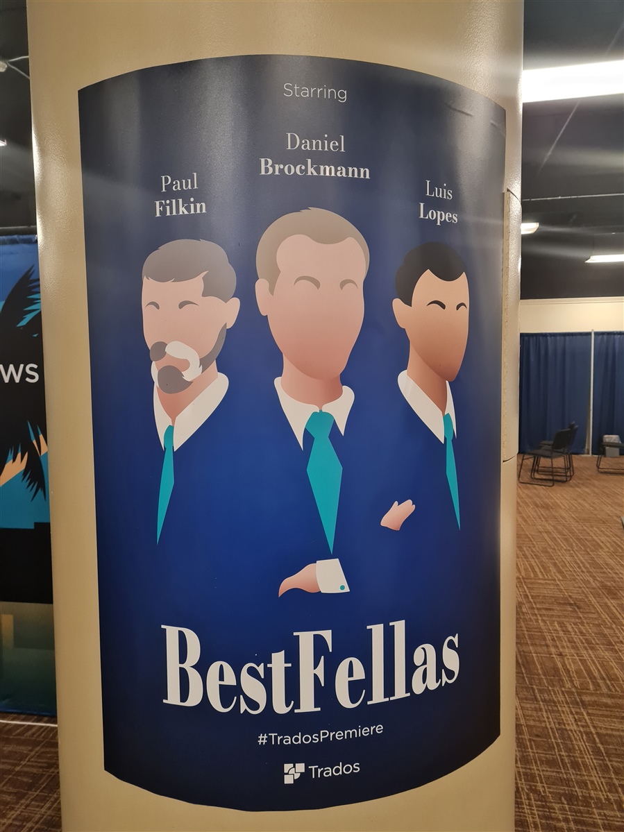 Promotional banner for Trados Studio with the title 'Best Fellas' and hashtag 'TradosPremiere'. Names featured are Paul Filkin, Daniel Brockmann, and Luis Lopes.