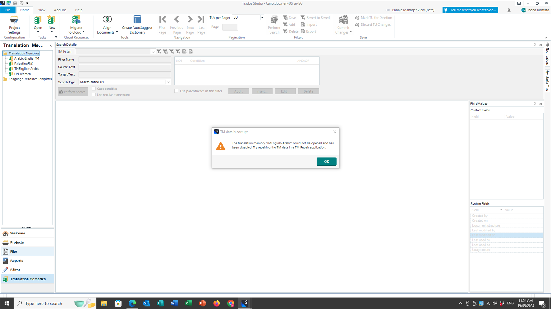 Screenshot of Trados Studio software with an error message window stating 'TM data is corrupt. The translation memory TMEnglish-Arabic could not be opened and has been disabled. Try repairing the TM data in a TM Repair application.'
