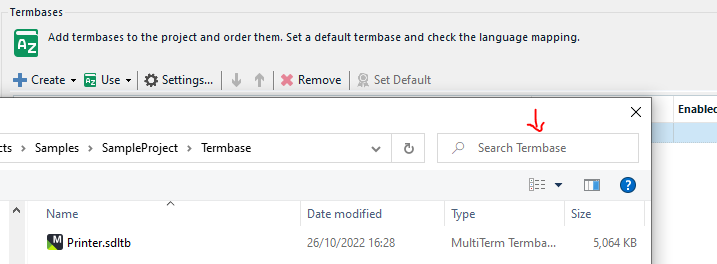 Trados Studio screenshot displaying the TermBases tab with a list of TermBases and a 'Search Termbase' field highlighted by a red arrow.