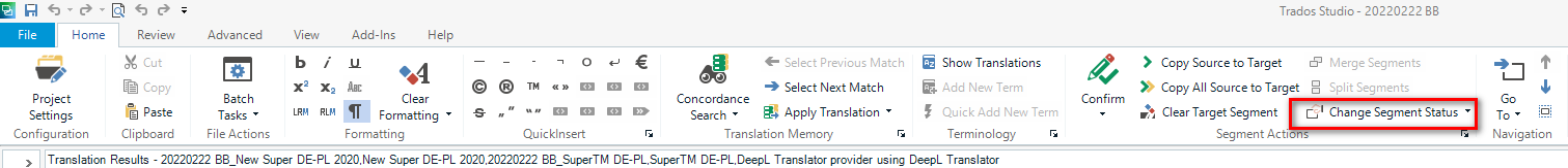 Trados Studio interface showing the 'Home' tab with various options. A red box highlights the 'Change Segment Status' button in the 'Segment Actions' section.