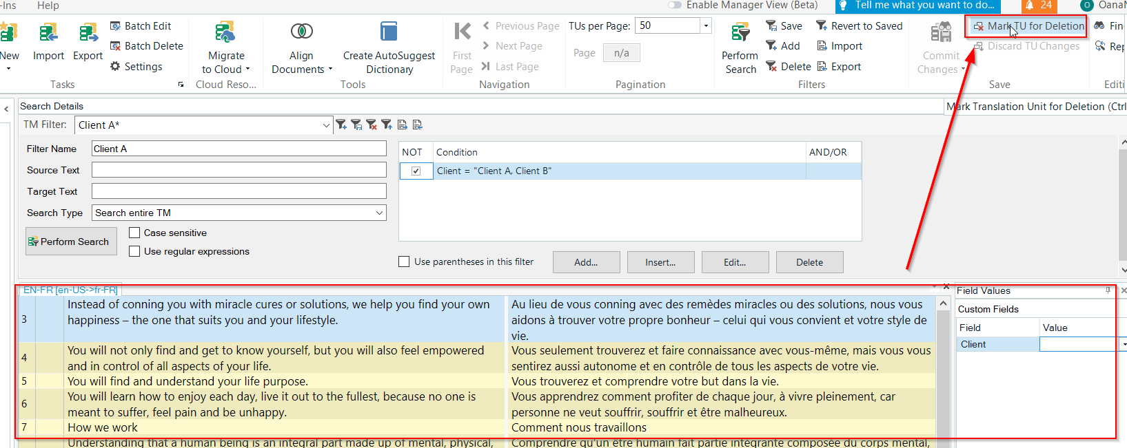 Trados Studio interface with a Translation Unit selected and a red arrow pointing to the 'Mark TU for Deletion' option in the toolbar.