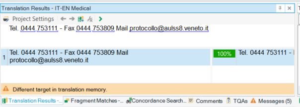 Screenshot of Trados Studio interface showing Translation Results pane with a warning 'Different target in translation memory.' Contact information is visible at the top.