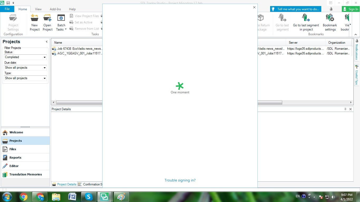 SDL Trados Studio sign-in window stuck on a loading screen with a green spinner and the text 'One moment'.