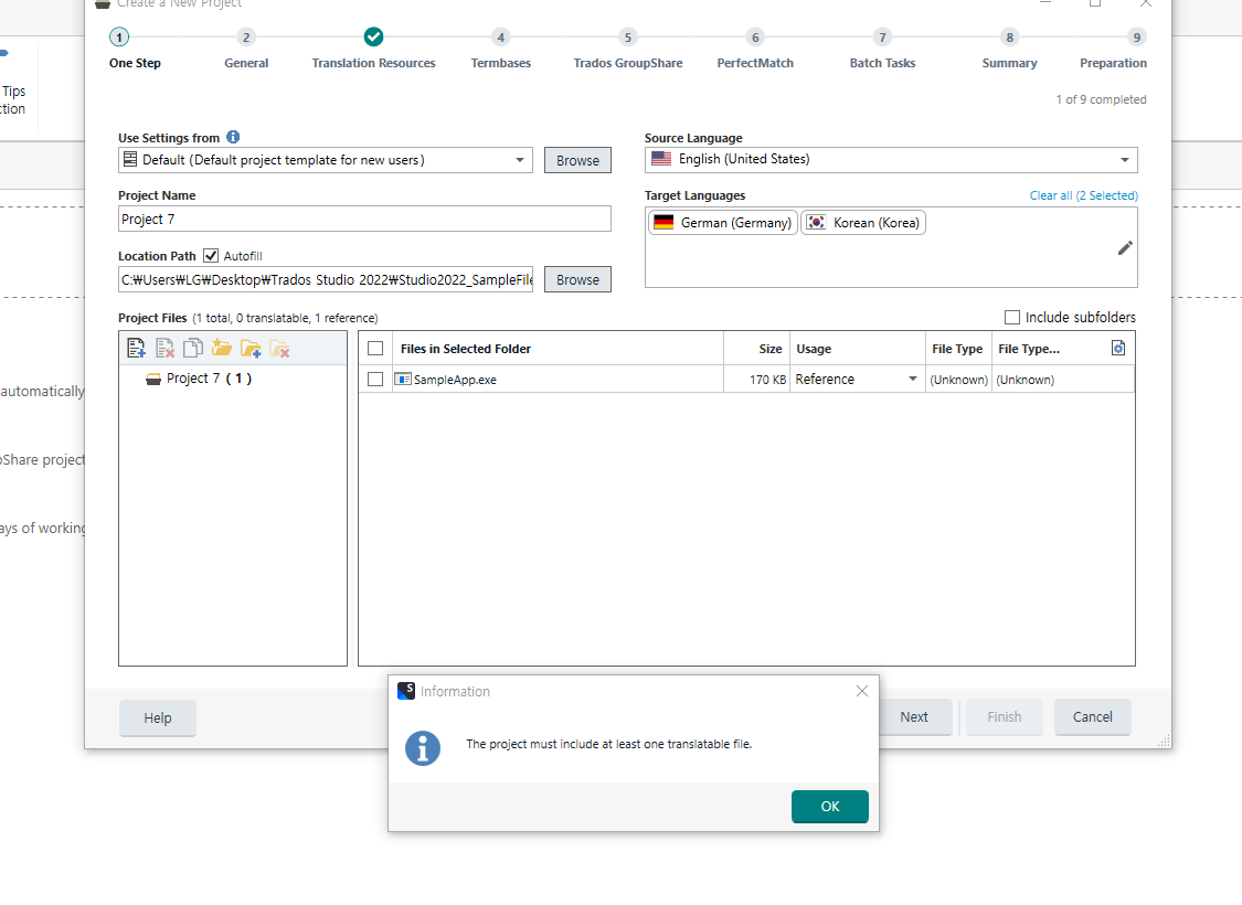 Trados Studio screenshot showing a new project creation with an information dialog box stating 'The project must include at least one translatable file.'