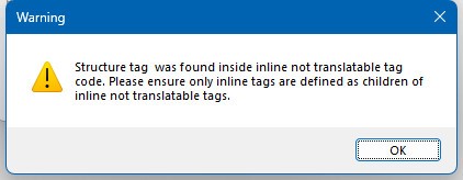 Warning message in Trados Studio stating 'Structure tag was found inside inline not translatable tag code. Please ensure only inline tags are defined as children of inline not translatable tags.' with an OK button.