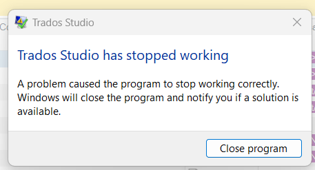 Error message window on Trados Studio stating 'Trados Studio has stopped working. A problem caused the program to stop working correctly. Windows will close the program and notify you if a solution is available.' with a 'Close program' button.