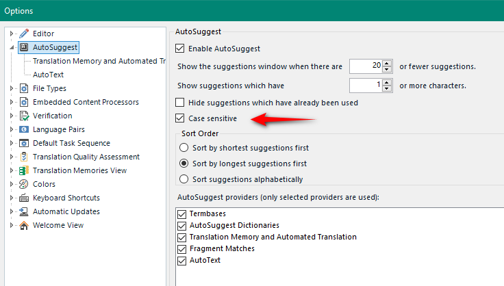 Trados Studio AutoSuggest options window with 'Case sensitive' option highlighted by a red arrow.