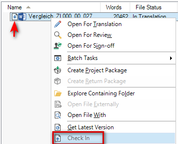 Trados Studio screenshot showing the 'Files' view with a file named 'Vergleich' selected. A red arrow points to the 'Check In' option in the right-click context menu, indicating the action to check-in the file.