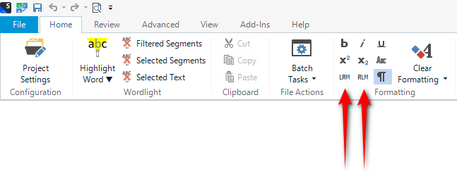 Trados Studio toolbar showing icons for 'Highlight Word', 'Filtered Segments', 'Selected Segments', 'Selected Text', 'Wordlight', 'Clipboard', 'Batch Tasks', 'File Actions', 'Clear Formatting' with two red arrows pointing at 'LRM' and 'RLM' icons.