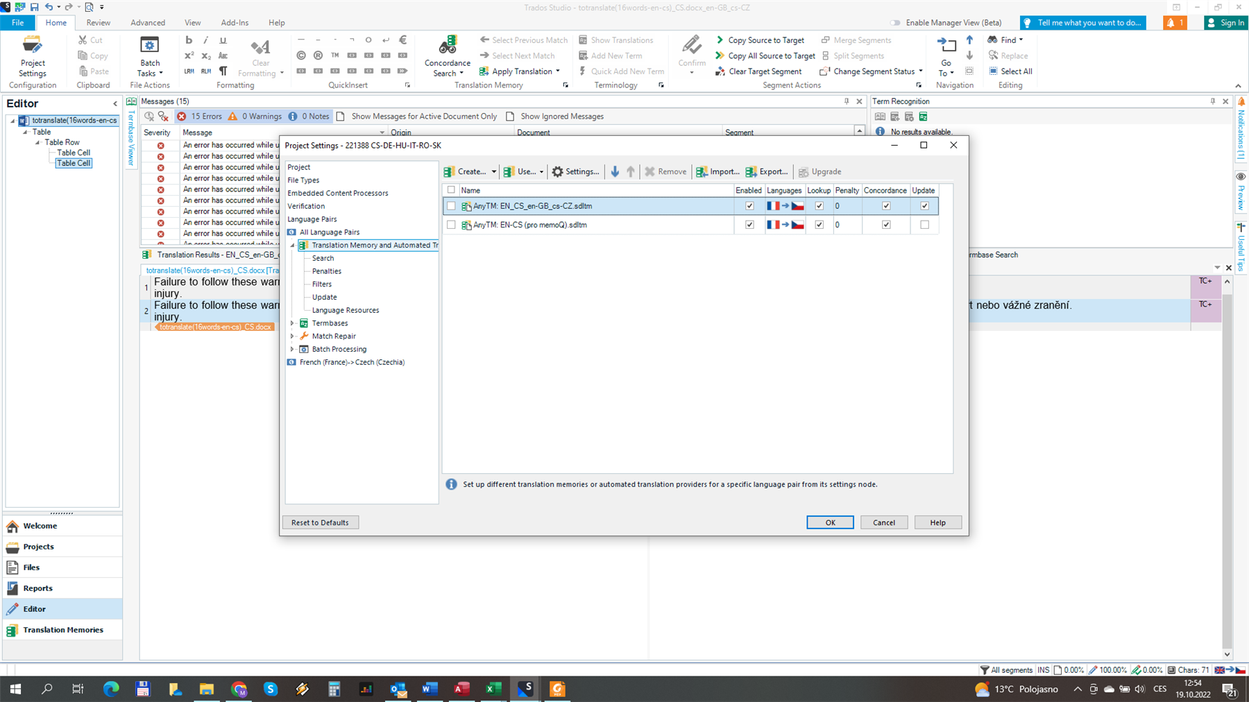 Screenshot of Trados Studio with an error message 'Failure to follow these warnings could result in minor or serious injury.' and a selected translation memory 'Any TM: EN-CS' showing an English to Czech language pair but with a French flag icon.