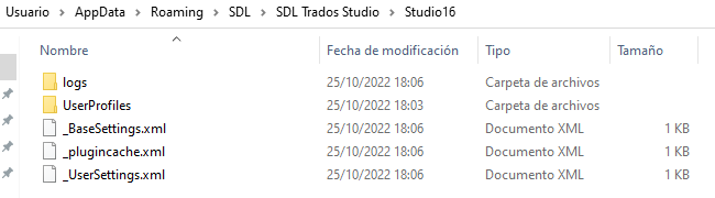 File explorer window showing contents of the Studio16 folder within SDL Trados Studio directory, including logs and UserProfiles folders, and BaseSettings.xml, plugincache.xml, and UserSettings.xml files.