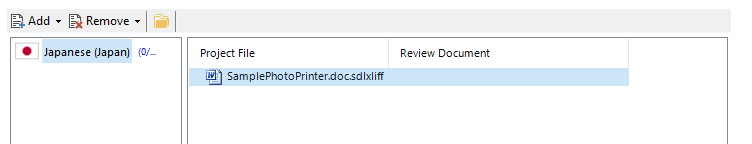 Trados Studio interface showing a warning icon next to 'Japanese (Japan)' language selection and a selected file named 'SamplePhotoPrinter.docx.sdlxliff' under the 'Project File' column.