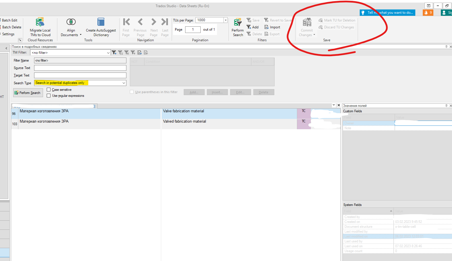 Trados Studio screenshot showing the 'Data Sheets' view with a search result displaying a single duplicate pair of translation units. The 'Commit Changes' and 'Save' buttons are circled, indicating they are inactive or not clickable.