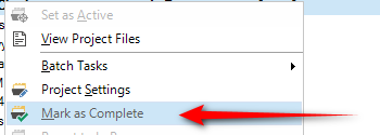 Trados Studio dropdown menu with an arrow pointing to 'Mark as Complete' option.