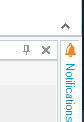 Screenshot showing an upward pointing arrow icon in Trados Studio, indicating the option to unpin the ribbon.
