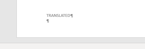 Close-up of Trados Studio 'TRANSLATED' section with a cursor indicating the start of a translation segment.