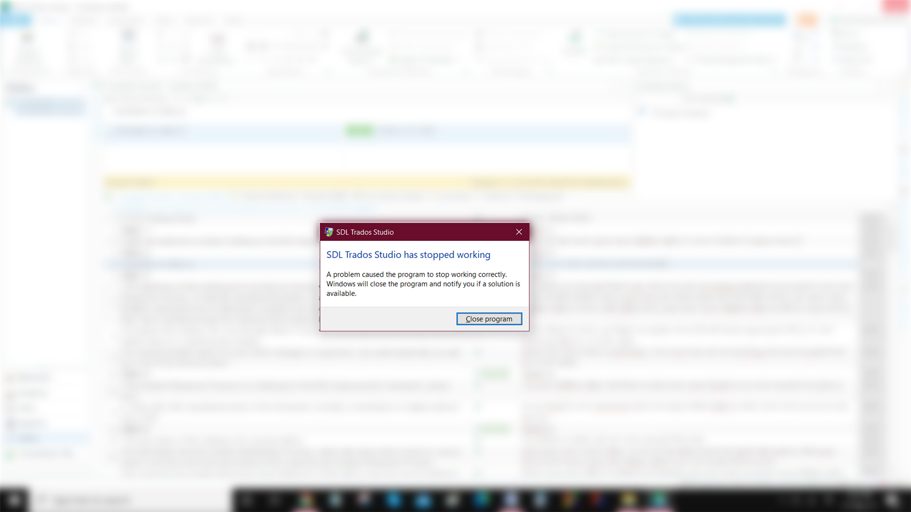 Error message window on top of Trados Studio interface stating 'SDL Trados Studio has stopped working. A problem caused the program to stop working correctly. Windows will close the program and notify you if a solution is available.' with a 'Close program' button.