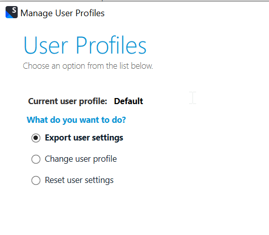 Trados Studio 'Manage User Profiles' window showing 'Current user profile: Default' with options to export, change, or reset user settings.