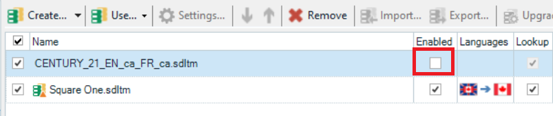 Screenshot of Trados Studio showing two projects. The 'Enabled' checkbox for the 'CENTURY_21_EN_ca_FR_ca.sdlm' project is unchecked, highlighted by a red box.