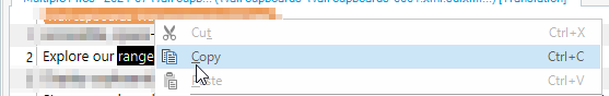 Screenshot of Trados Studio interface showing a segment number '2' with source text 'Explore our range' and a context menu with options 'Cut', 'Copy', and 'Paste'.